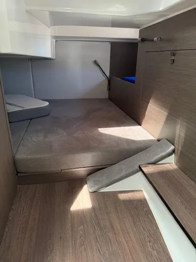 Fortuna Yacht Photos Pics Interior cabin of 2022 Beneteau 32 Gran Turismo yacht, featuring modern wood finish.