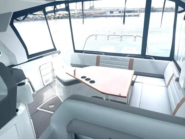 Fortuna Yacht Photos Pics Interior of 2022 Beneteau 32 Gran Turismo yacht with sleek seating and table.