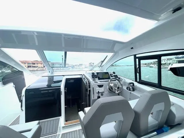 Fortuna Yacht Photos Pics Interior of 2022 Beneteau 32 Gran Turismo yacht with modern helm and seating.