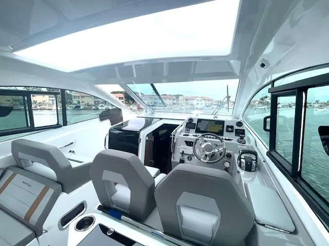 Fortuna Yacht Photos Pics Interior of 2022 Beneteau 32 Gran Turismo yacht with modern helm and seating.