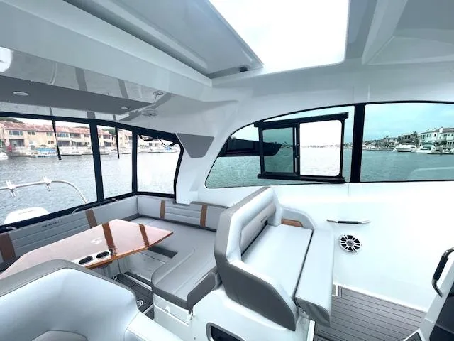 Fortuna Yacht Photos Pics Interior of 2022 Beneteau 32 Gran Turismo yacht with modern seating and waterfront view.