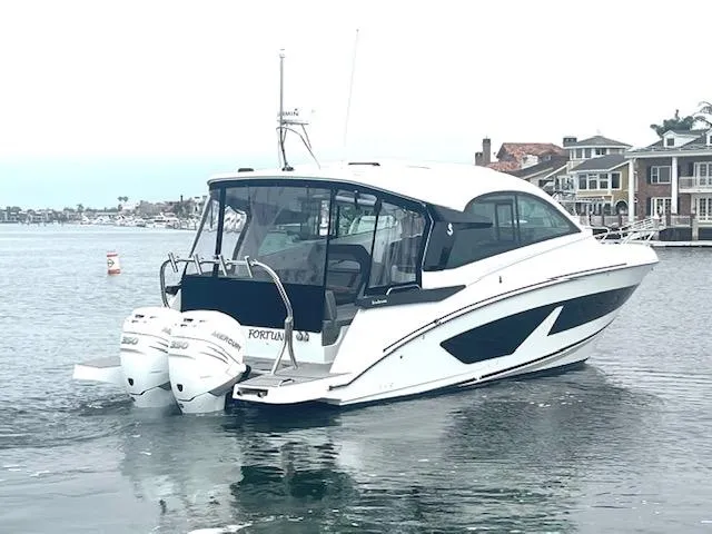 Fortuna Yacht Photos Pics 2022 Beneteau 32 Gran Turismo boat on water, featuring twin outboard engines.