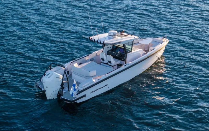  Yacht Photos Pics 2025 Axopar 29 CCX boat on open water, showcasing sleek design and modern features.