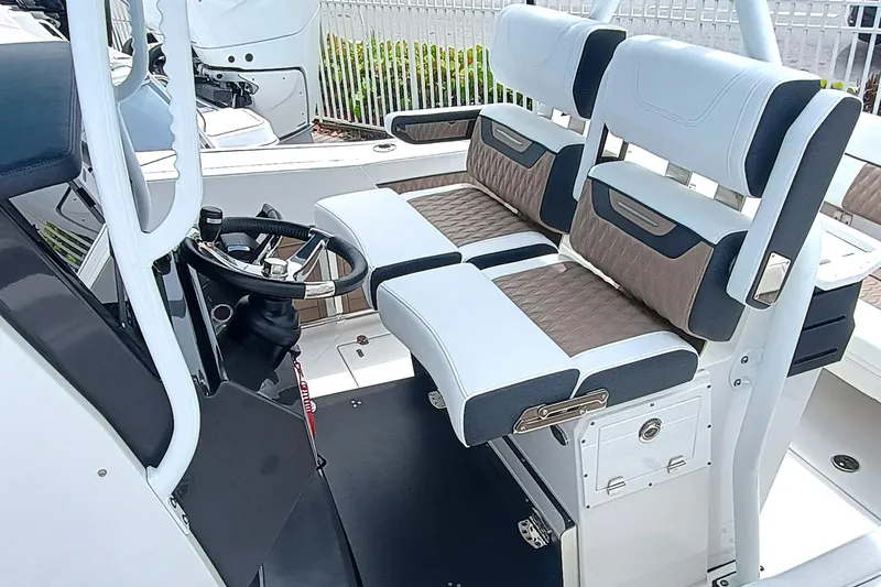 272-499 Yacht Photos Pics 2025 Blackfin 272 CC boat interior with dual seating and steering console.