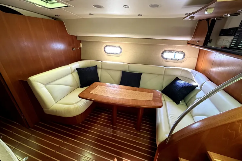  Yacht Photos Pics Luxurious interior of 2008 Tiara Yachts 4300 Sovran with elegant seating and wooden table.