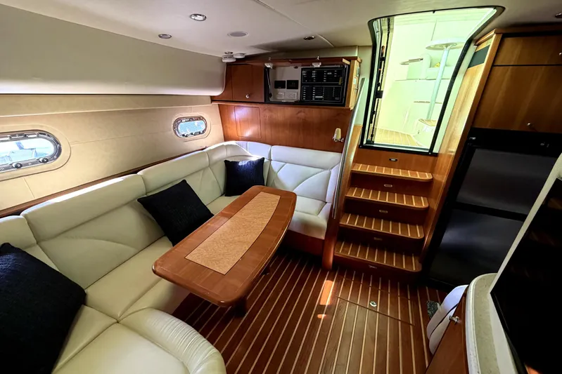  Yacht Photos Pics Luxurious interior of 2008 Tiara Yachts 4300 Sovran with elegant seating and wooden finishes.