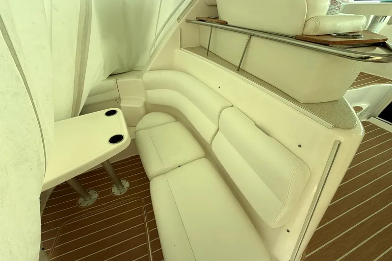  Yacht Photos Pics 2008 Tiara Yachts 4300 Sovran interior with white seating and wooden flooring.