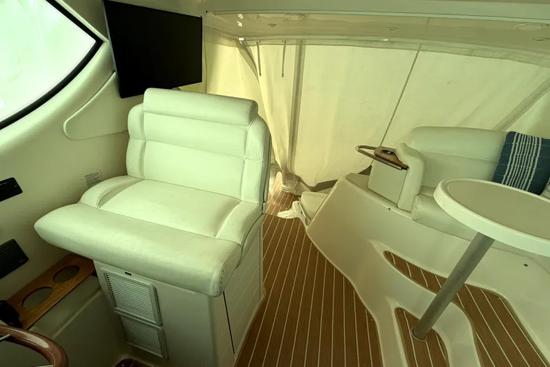  Yacht Photos Pics Interior of 2008 Tiara Yachts 4300 Sovran with white seating and wood flooring.