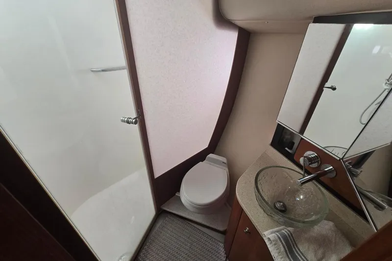  Yacht Photos Pics Luxurious 2008 Tiara Yachts 4300 Sovran bathroom with modern fixtures and glass sink.