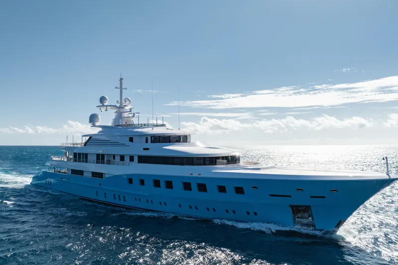 Axioma Yacht Photos Pics Luxurious 2013 Dunya Yacht cruising on open sea under clear blue sky.