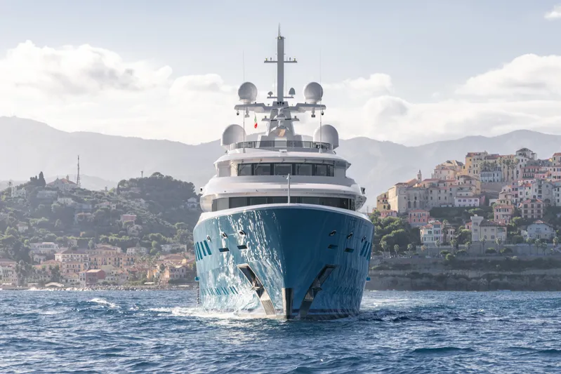 Axioma Yacht Photos Pics Luxurious 2013 Dunya Yacht cruising near scenic coastal town.