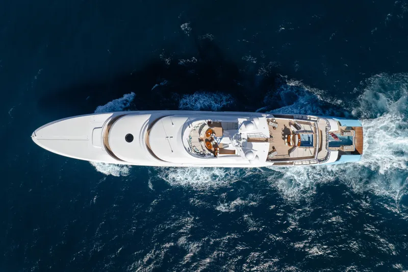 Axioma Yacht Photos Pics Aerial view of 2013 Dunya Yacht cruising through deep blue ocean waters.