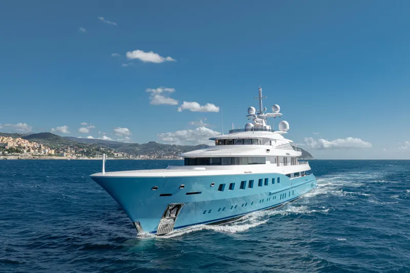 Axioma Yacht Photos Pics Luxurious 2013 Dunya Yacht cruising on open sea under clear blue sky.