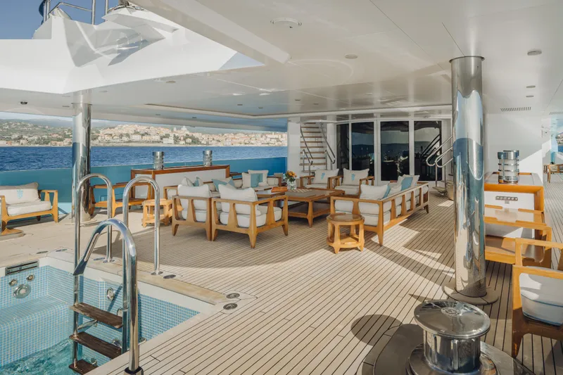 Axioma Yacht Photos Pics Luxurious 2013 Dunya Yacht deck with pool, elegant seating, and ocean view.