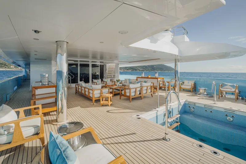 Axioma Yacht Photos Pics Luxurious 2013 Dunya Yacht deck with pool, elegant seating, and ocean view.