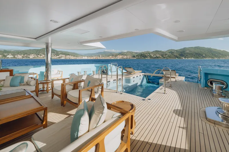 Axioma Yacht Photos Pics Luxurious 2013 Dunya Yacht deck with pool, elegant seating, and scenic ocean view.