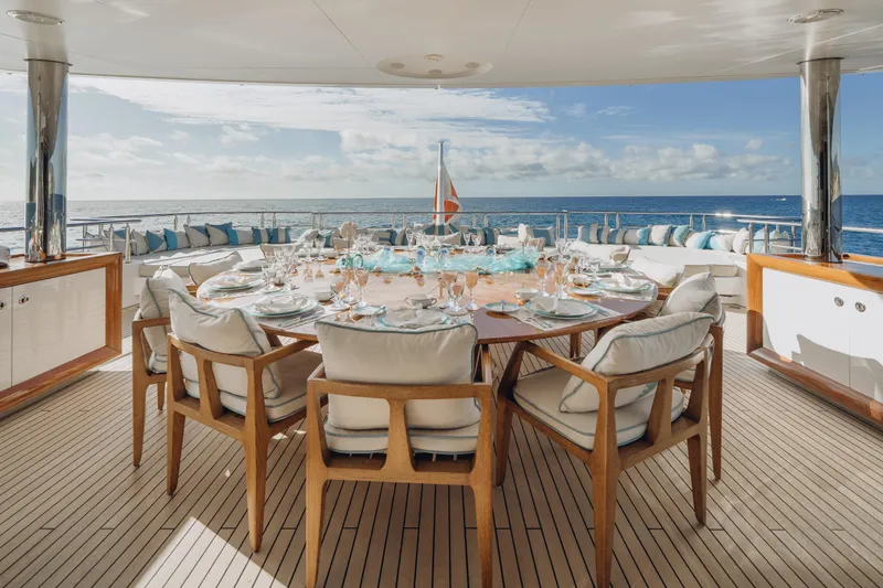 Axioma Yacht Photos Pics Luxurious dining setup on 2013 Dunya Yacht with ocean view and elegant tableware.