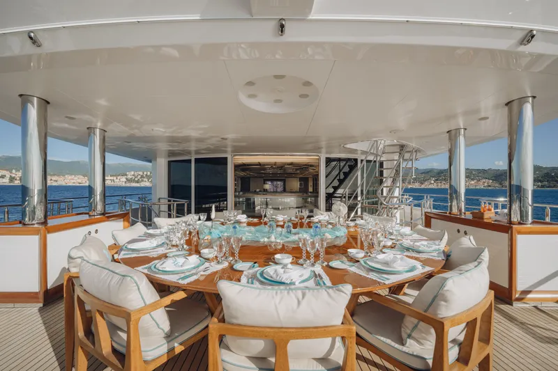 Axioma Yacht Photos Pics Luxurious dining setup on 2013 Dunya Yacht with ocean view and elegant tableware.