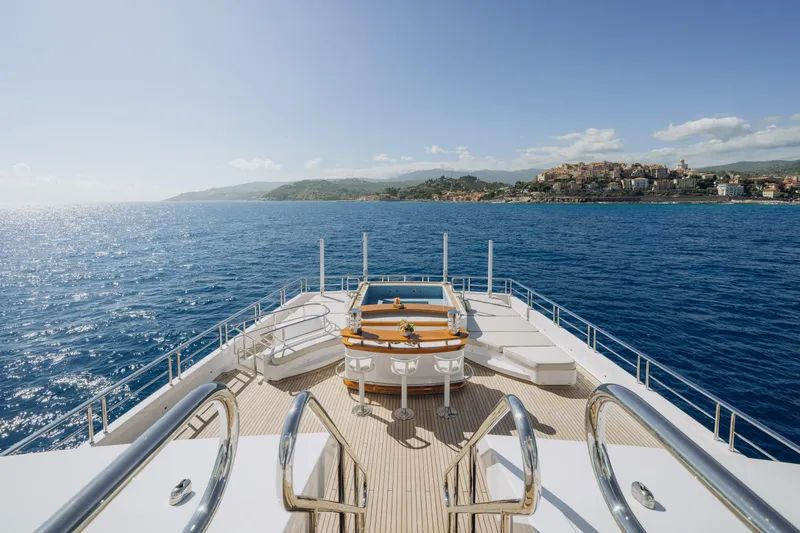 Axioma Yacht Photos Pics Luxurious 2013 Dunya Yacht deck with ocean view and coastal town in the background.