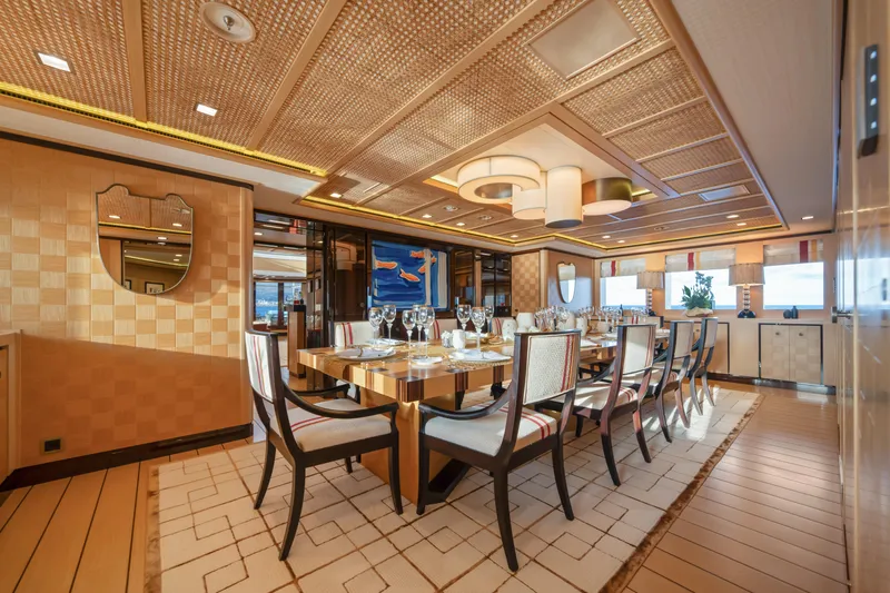 Axioma Yacht Photos Pics Luxurious dining area on 2013 Dunya Yacht, featuring elegant decor and a spacious table setting.