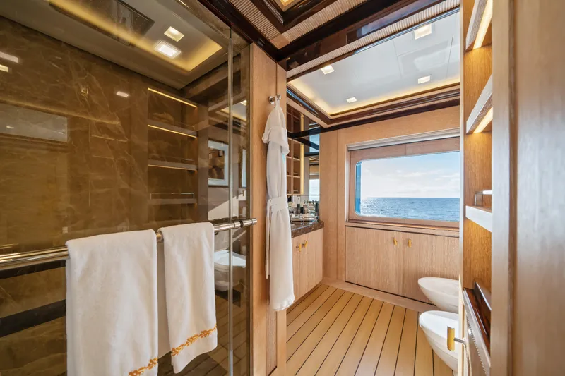 Axioma Yacht Photos Pics Luxurious 2013 Dunya Yacht bathroom with ocean view, elegant wood finishes, and modern amenities.