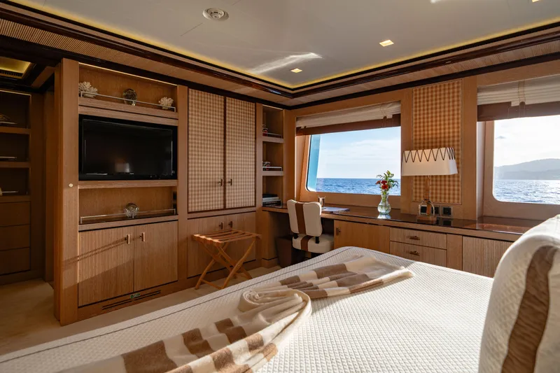 Axioma Yacht Photos Pics Luxurious 2013 Dunya Yacht interior with elegant wood finishes, ocean view, and cozy bedroom setup.
