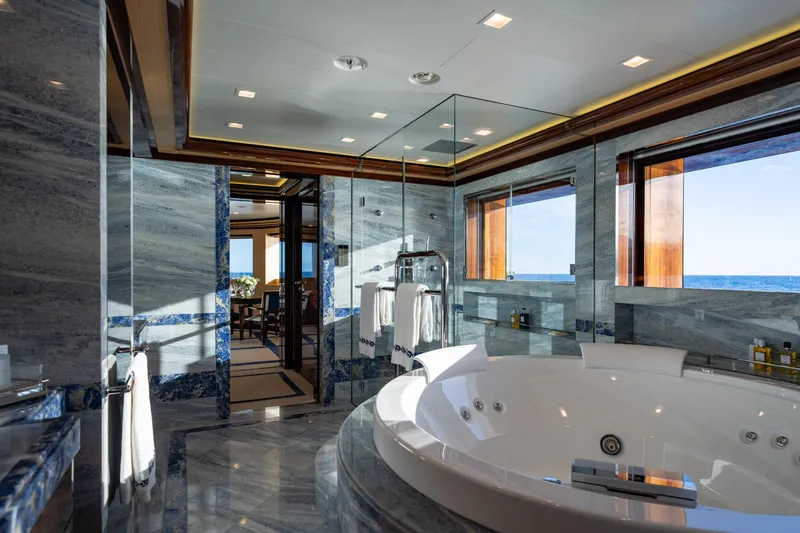 Axioma Yacht Photos Pics Luxurious bathroom on 2013 Dunya Yacht with ocean view, featuring marble and jacuzzi.
