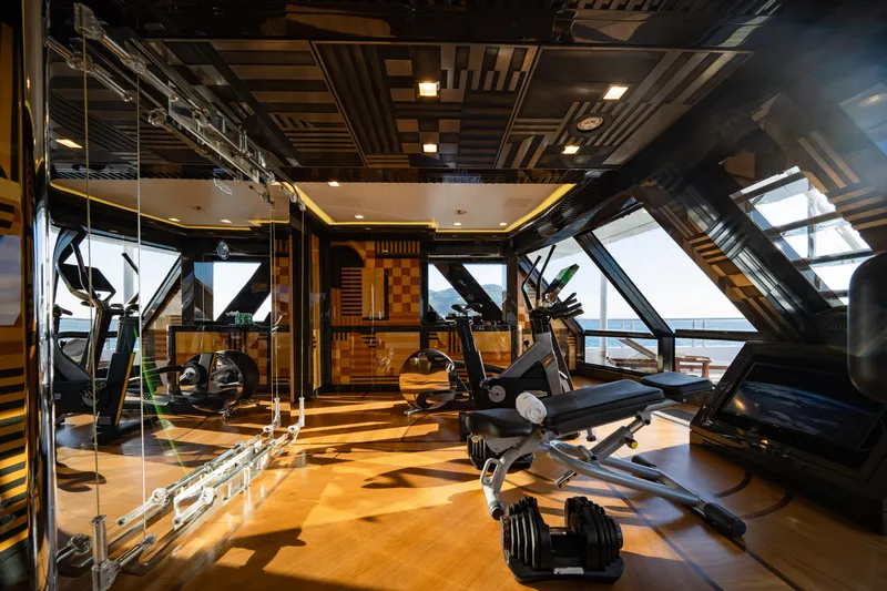 Axioma Yacht Photos Pics Luxurious gym on 2013 Dunya Yacht with modern equipment and ocean views.