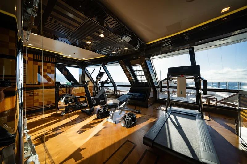 Axioma Yacht Photos Pics Luxurious gym on 2013 Dunya Yacht with ocean view, featuring modern exercise equipment.