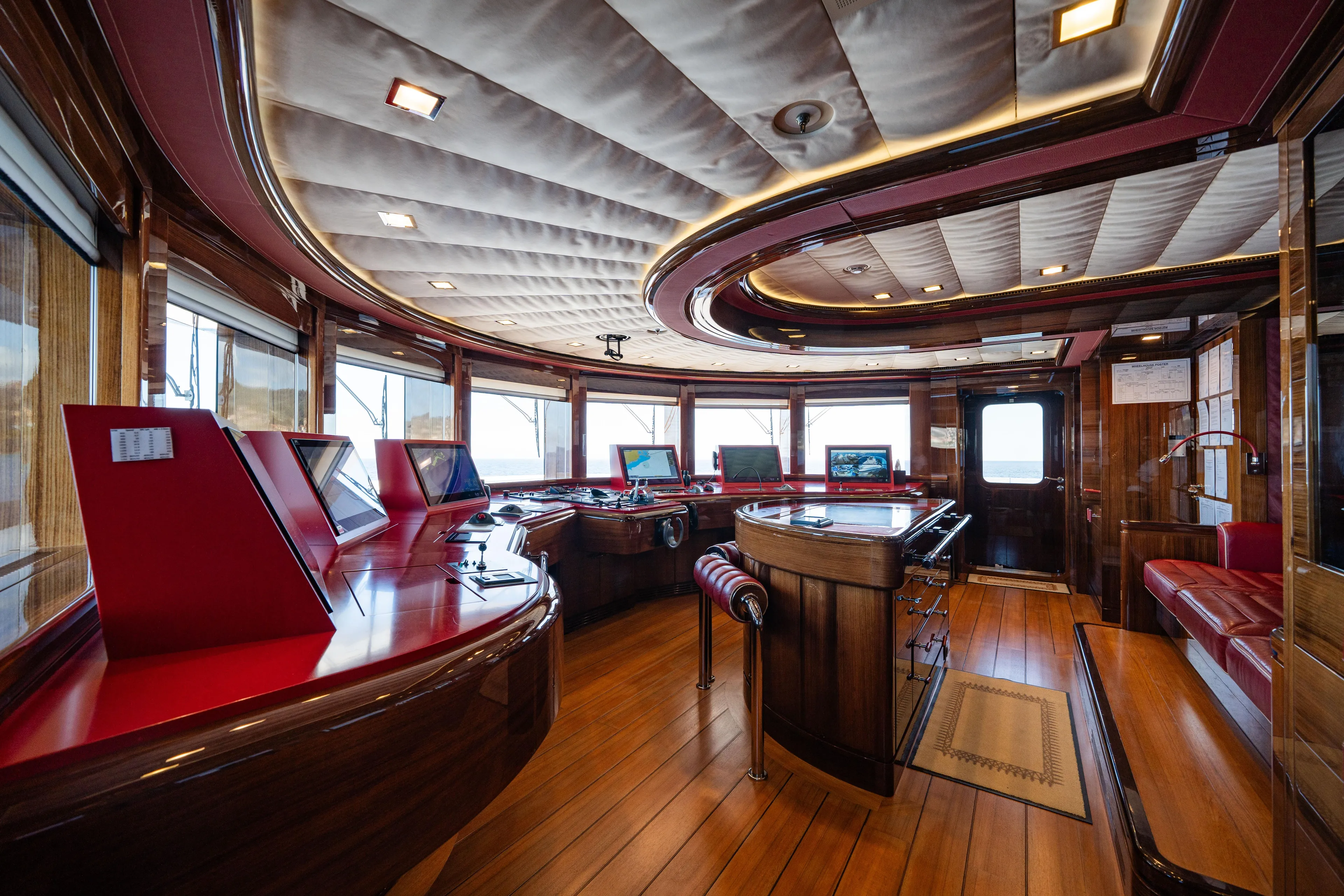 Axioma Yacht Photos Pics Luxurious interior of 2013 Dunya Yacht with elegant wood and red accents.