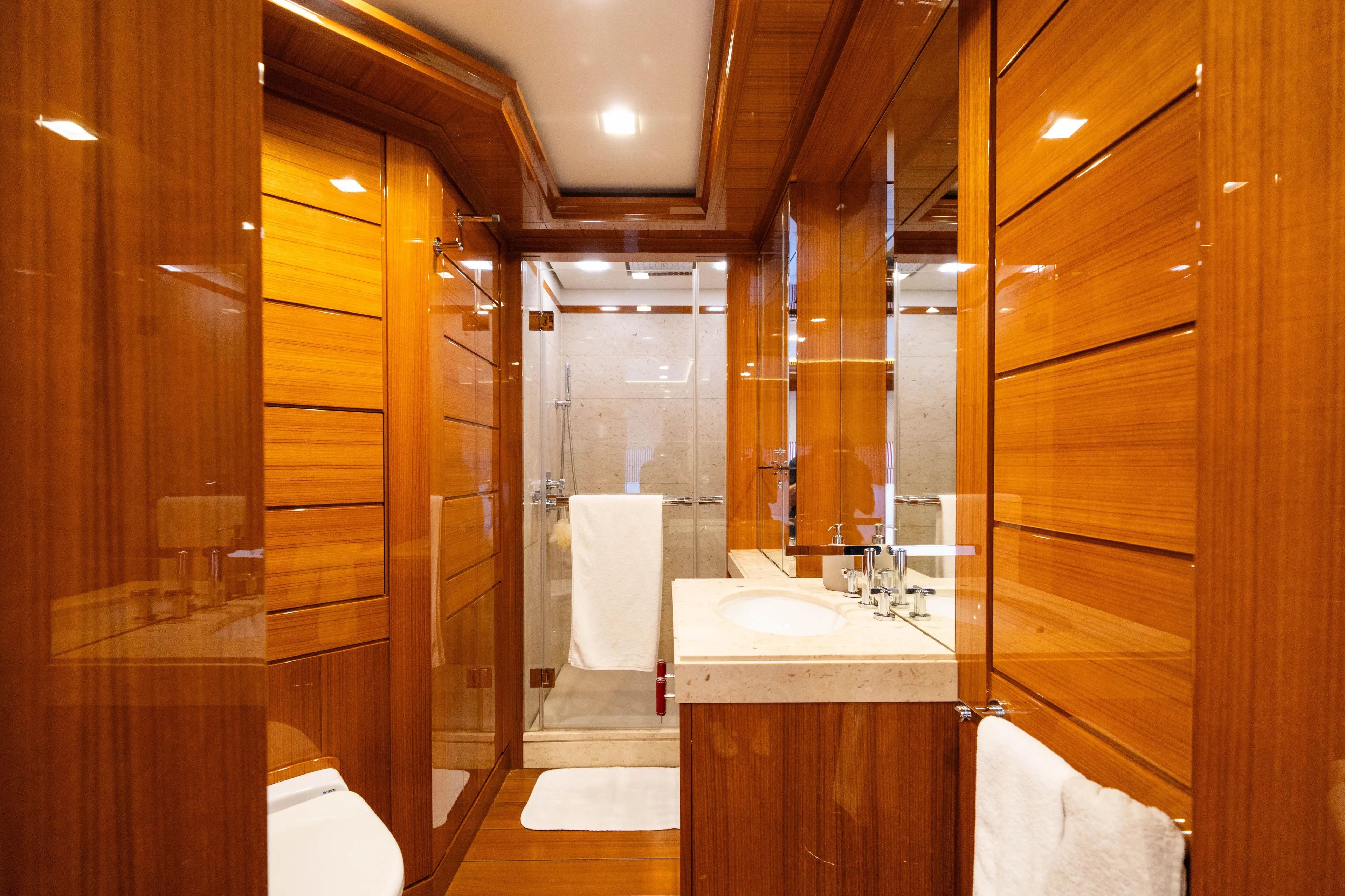 Axioma Yacht Photos Pics Luxurious wooden bathroom interior on a 2013 Dunya Yacht, featuring modern fixtures and elegant design.
