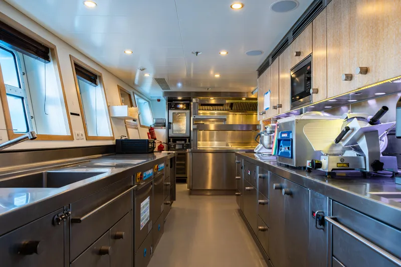 Axioma Yacht Photos Pics Modern kitchen interior on 2013 Dunya Yacht, featuring stainless steel appliances and ample workspace.