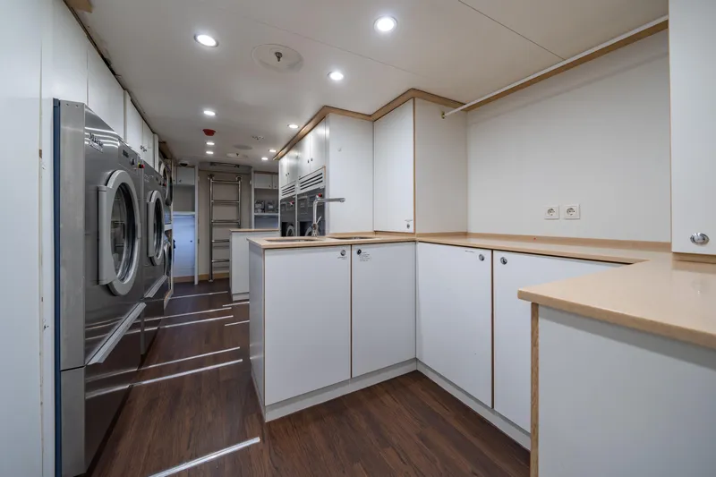 Axioma Yacht Photos Pics Laundry room on 2013 Dunya Yacht with modern appliances and sleek cabinetry.