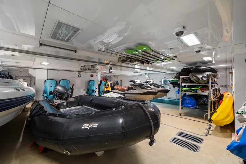 Axioma Yacht Photos Pics Luxurious 2013 Dunya Yacht interior with watercraft and equipment storage.