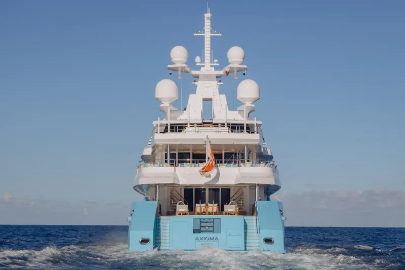 Axioma Yacht Photos Pics Luxurious 2013 Dunya Yacht cruising on open sea under clear blue sky.