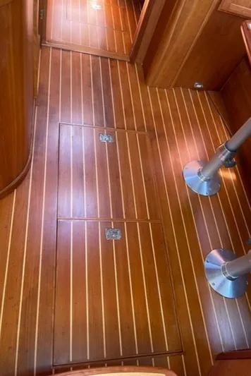 Black Bird Yacht Photos Pics 2006 Sabre 38 Hard Top Express interior with polished wooden flooring.