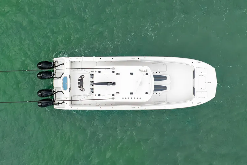 Kroppdustr Yacht Photos Pics Aerial view of 2023 Invincible 37 Catamaran on green water.