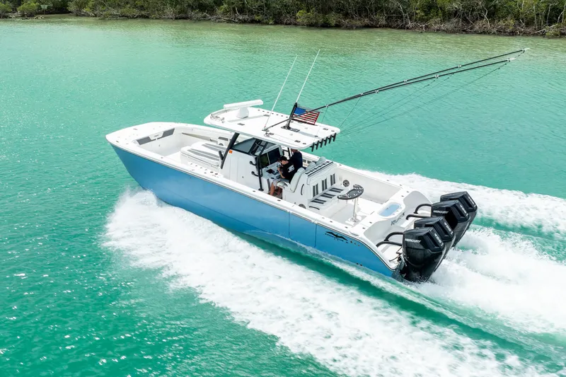 Kroppdustr Yacht Photos Pics 2023 Invincible 37 Catamaran cruising on turquoise water.