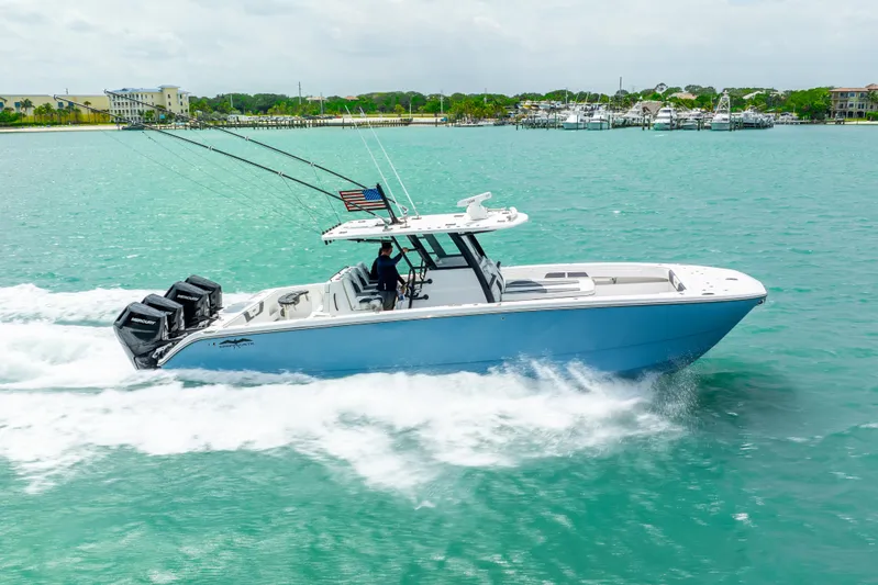 Kroppdustr Yacht Photos Pics 2023 Invincible 37 Catamaran cruising on turquoise waters.