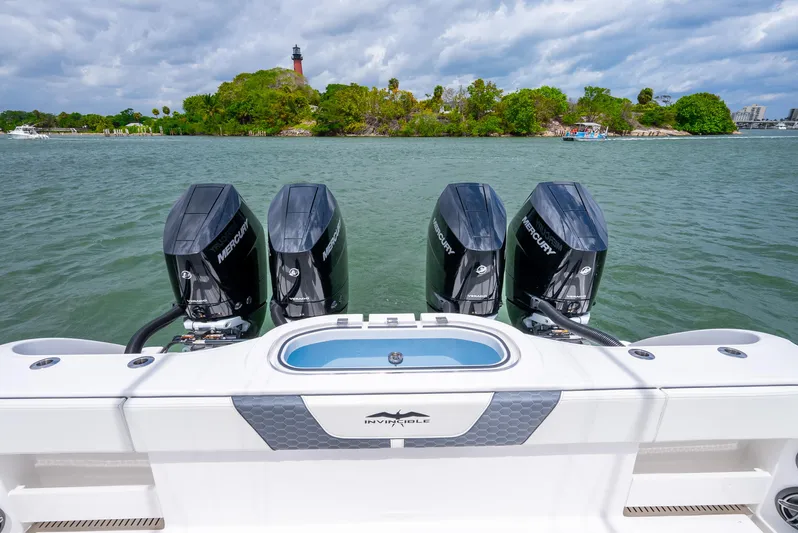 Kroppdustr Yacht Photos Pics 2023 Invincible 37 Catamaran with four Mercury outboard engines on the water.