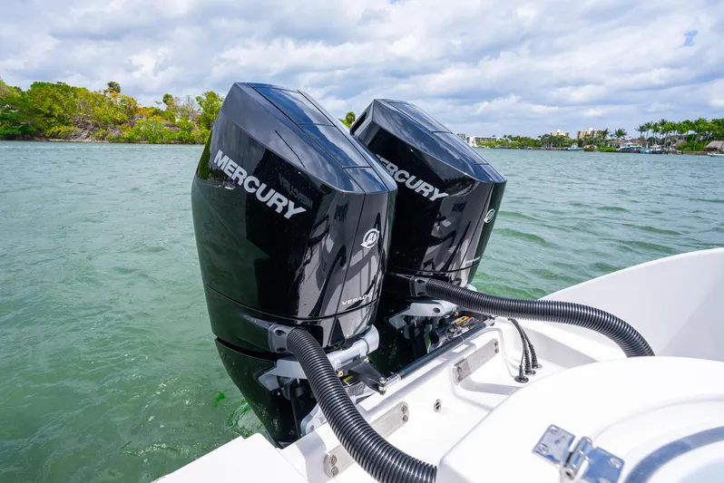 Kroppdustr Yacht Photos Pics Twin Mercury outboard engines on a 2023 Invincible 37 Catamaran in a scenic waterway.