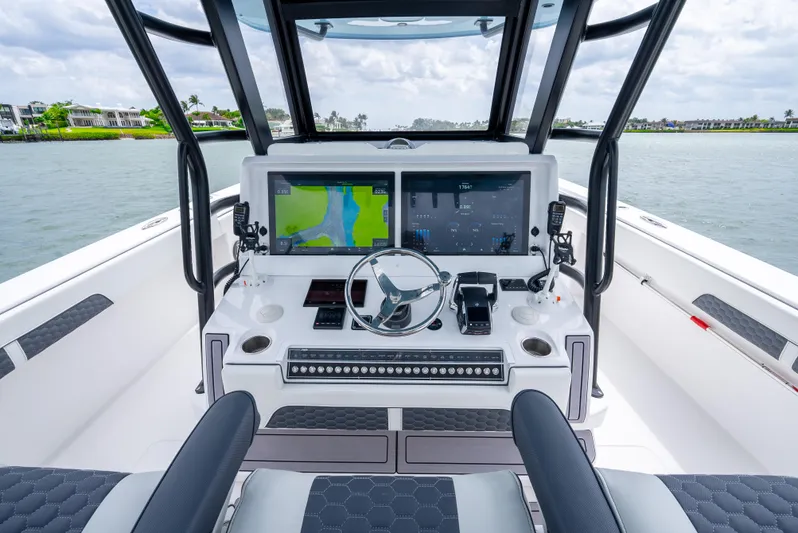 Kroppdustr Yacht Photos Pics 2023 Invincible 37 Catamaran helm with dual navigation screens and modern controls.