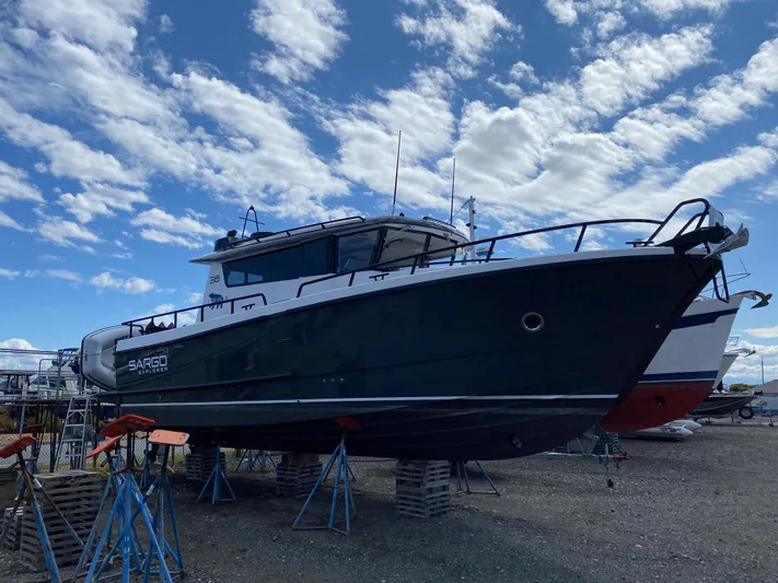 Ursa Yacht Photos Pics 2019 Sargo 36 Explorer boat on stands under a partly cloudy sky.