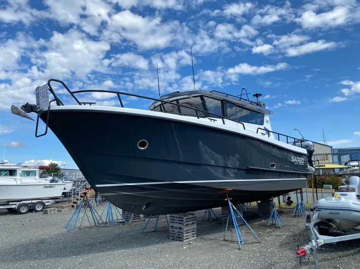 Ursa Yacht Photos Pics 2019 Sargo 36 Explorer boat on stands, under a partly cloudy sky.