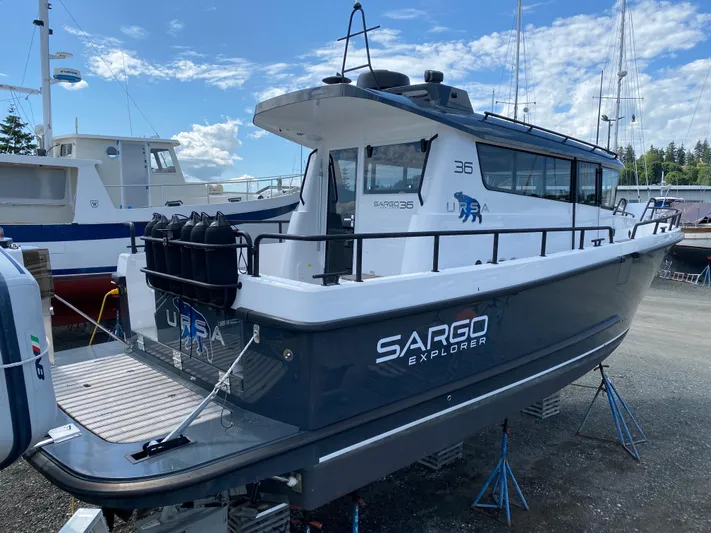 Ursa Yacht Photos Pics 2019 Sargo 36 Explorer boat on stands, docked outdoors under a blue sky.