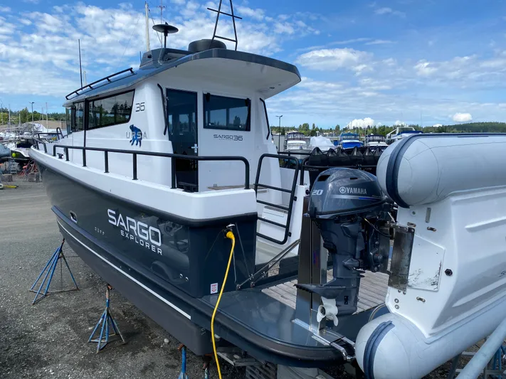 Ursa Yacht Photos Pics 2019 Sargo 36 Explorer boat with Yamaha engine, docked on land under a blue sky.