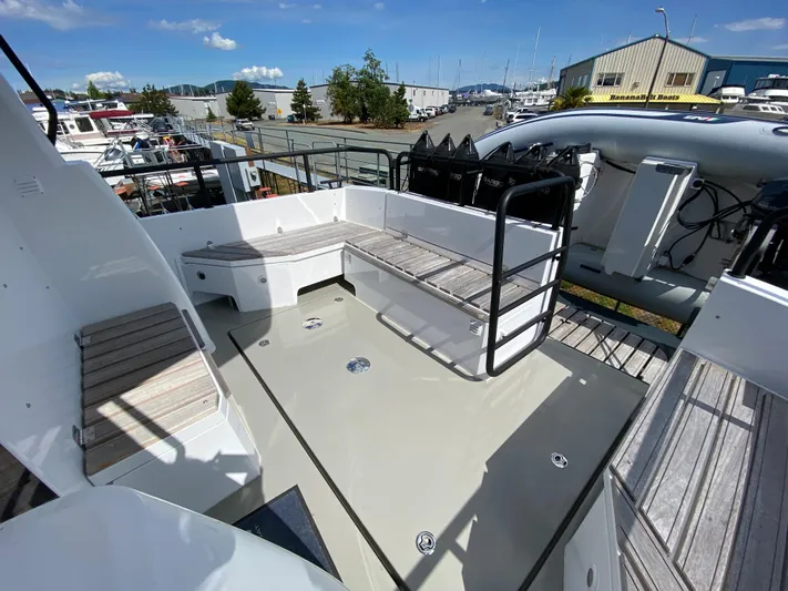 Ursa Yacht Photos Pics Sargo 36 Explorer 2019 boat deck with seating, docked at a marina under clear skies.