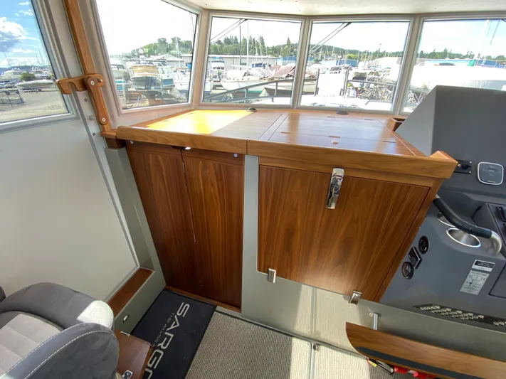 Ursa Yacht Photos Pics Interior of 2019 Sargo 36 Explorer boat with wooden cabinetry and panoramic windows.