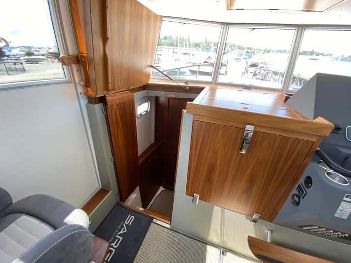 Ursa Yacht Photos Pics Interior of 2019 Sargo 36 Explorer boat with wooden cabinetry and seating.