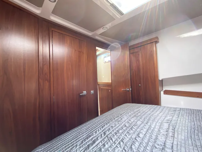Ursa Yacht Photos Pics Interior of 2019 Sargo 36 Explorer with wooden cabinetry and a bed.